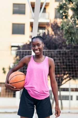 Portrait of Female Basketball Player Holding Ball