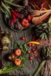 Assorted vegetables and napkins on table