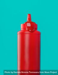 Ketchup bottle close up, isolated on a blue background 5ngElm