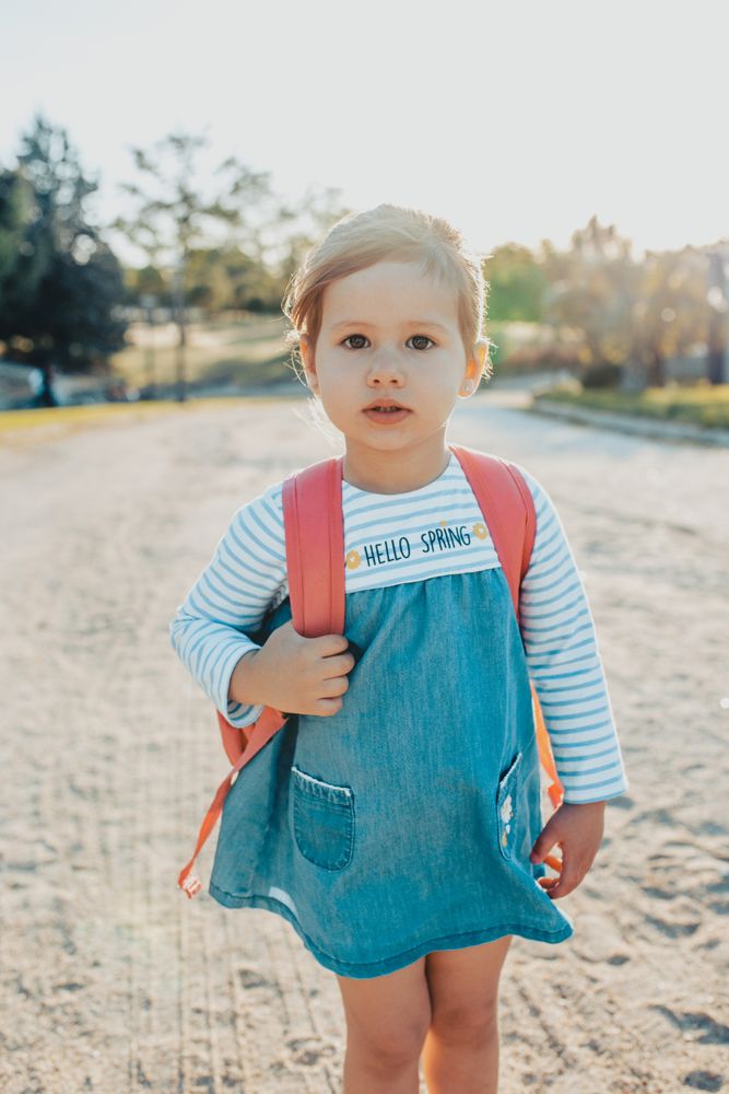 Little girl standing in park