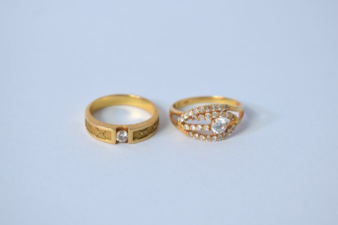 Two diamond rings on blank background
