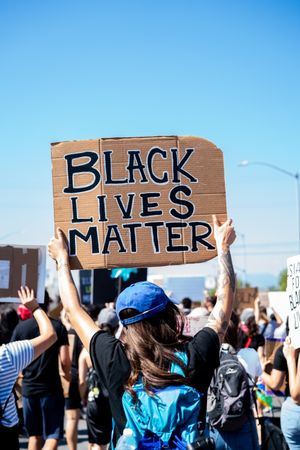 Los Angeles, CA, USA — June 7th, 2020: person holding “Black lives matter” sign at rally