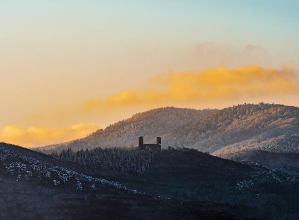 The warm colors of the setting sun on the snowy foothills of the Vosges. Alsace.