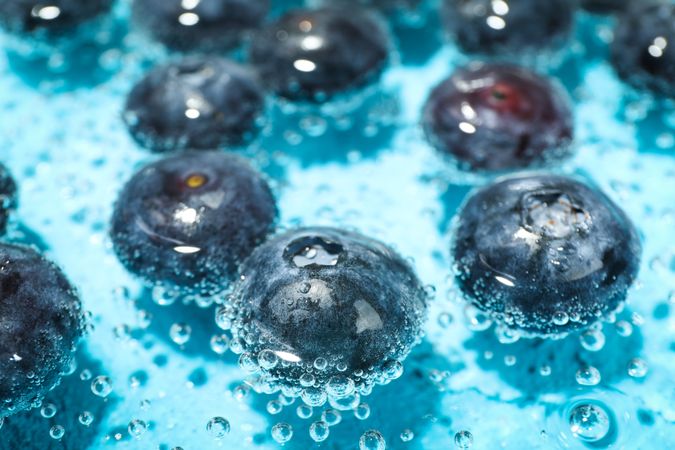 Close up of blueberries soaking in sparkling water