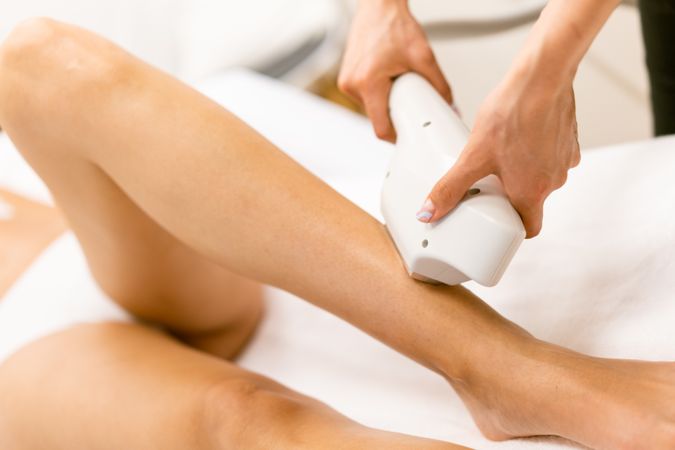 Close up of leg receiving a laser hair removal treatment