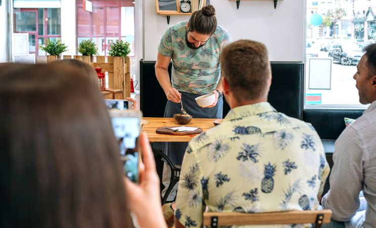 Young cook giving a cooking workshop