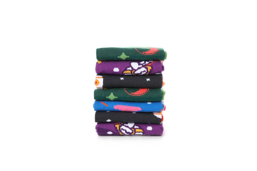 Stack of socks isolated on light background