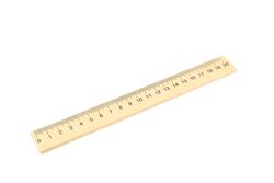 Wooden ruler isolated on studio background. Stationery
