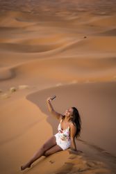 Woman taking selfie in desert
