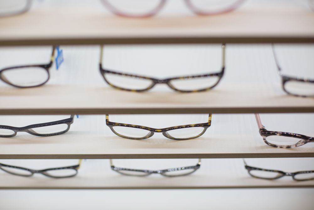 glasses on a shelf in a store
