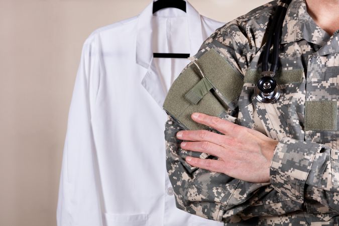 Medical military doctor with consultation coat in background