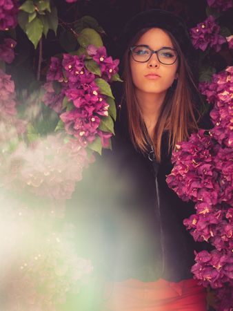 Woman on background of stunning violet flowers