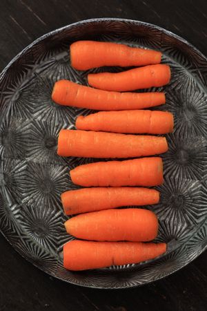 Top View Baby Carrot on Rustic Tray