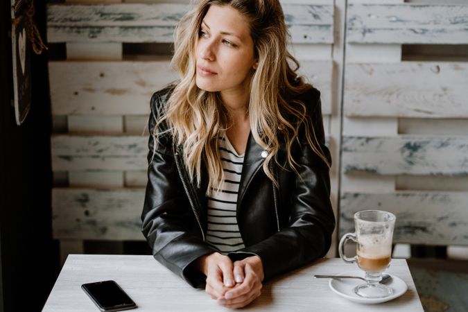 Woman using smartphone at table