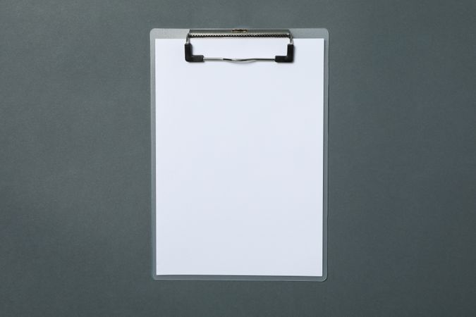 Empty clipboard on light dark background, space for text