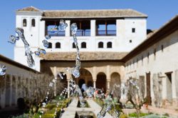 Water feature in foreground of courtyard of the acequia in Generalife, Alhambra, Granada