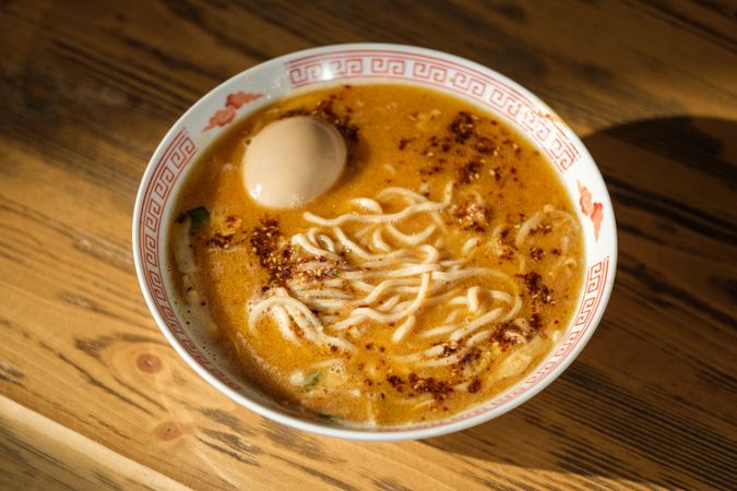 Bowl with ramen on table