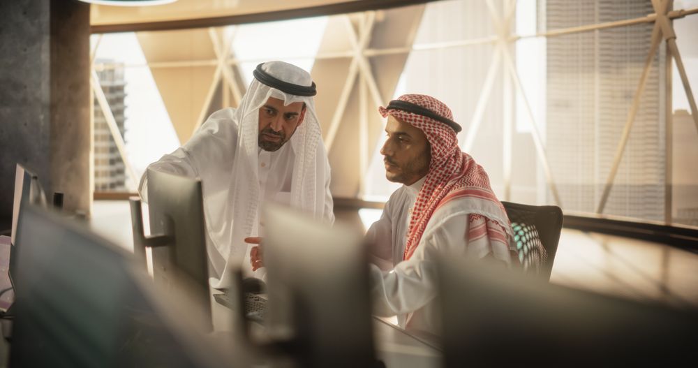 Two Young Middle Eastern Colleagues Working in a Business Software Development Company.
