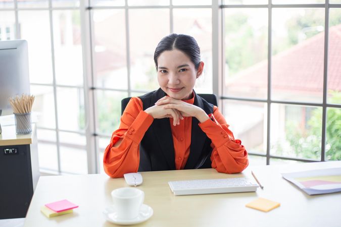 Confident female working in a bright office