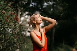 Dreamy young woman in summer garden