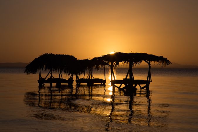 Laundry in sea at sunset