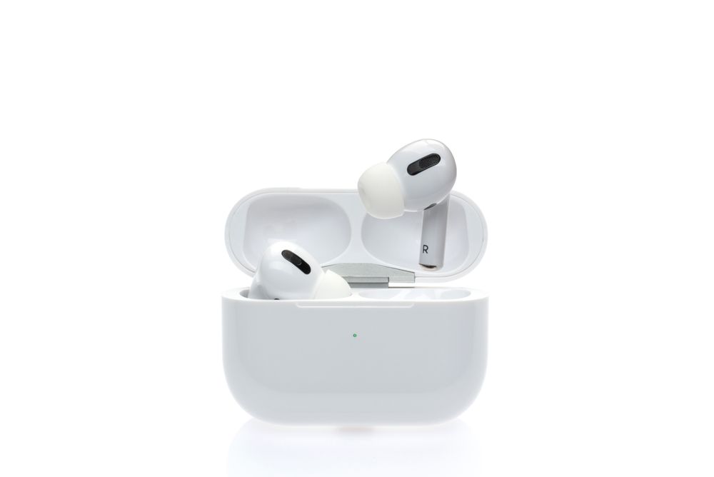 Wireless earbuds on plain background