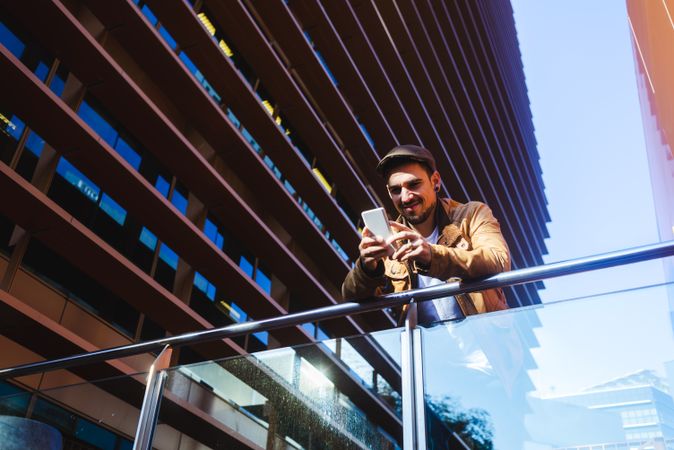 Man using mobile phone in modern building