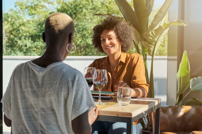 Diverse female friends resting in restaurant