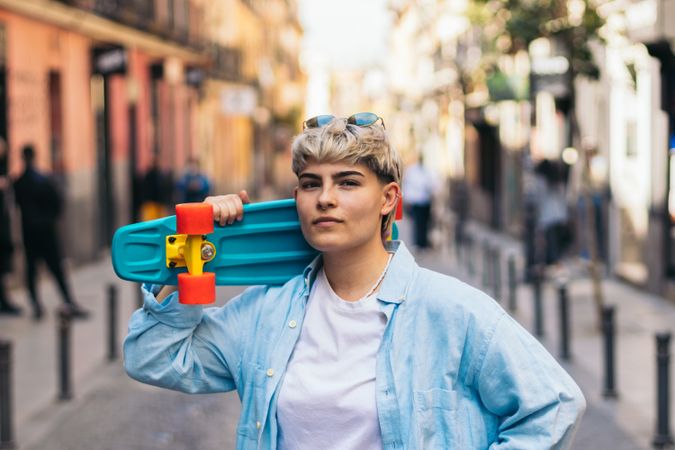 stylish woman with short hair and a skate. portrait