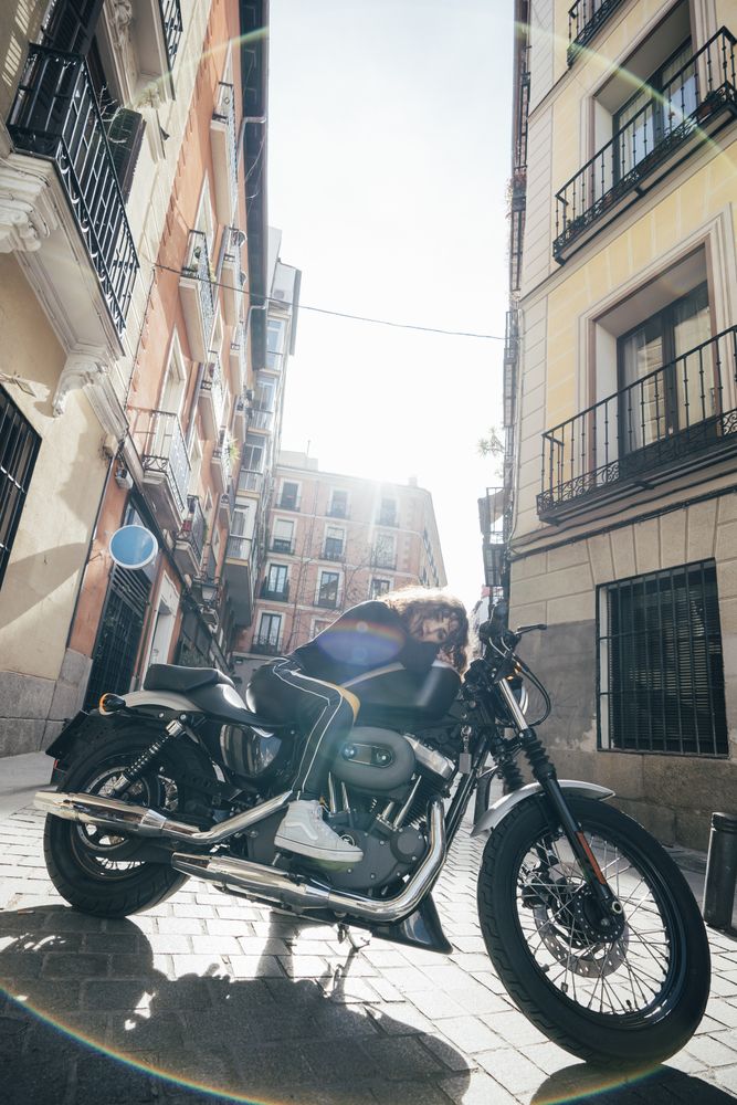 Young woman in custom motorbike