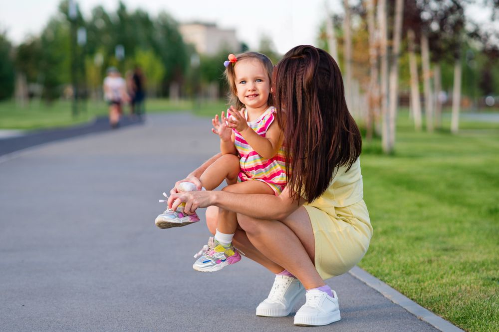 Toddler girl and mom on walk