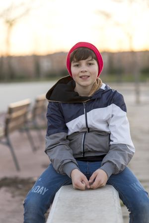 Young teenager portrait at sunrise in park