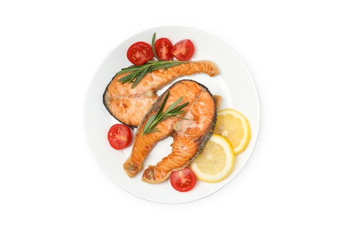 Plate with grilled salmon isolated on blank background