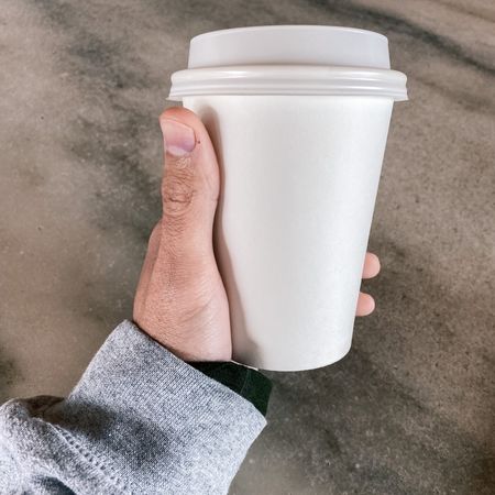 holding a coffee cup