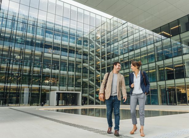 Positive businesspeople walking from work together