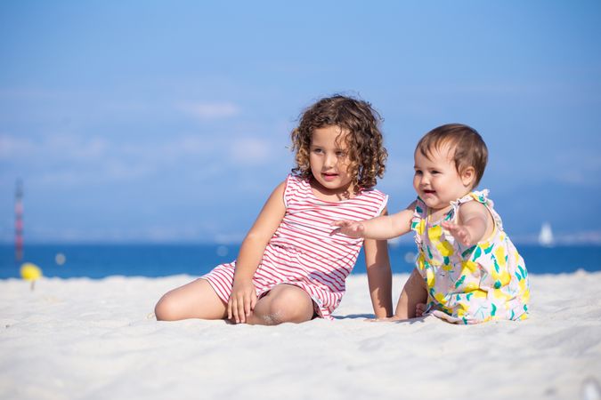 Kids playing on beach in summer