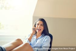 Woman using toothbrush in bright room 5nGY84