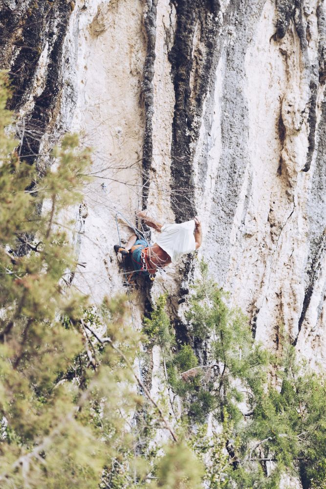 Anonymous man climbing rock