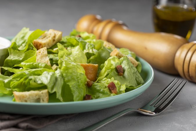 Caesar salad with croutons and bacon.