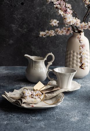 Tea time with apricot blossoms in vase
