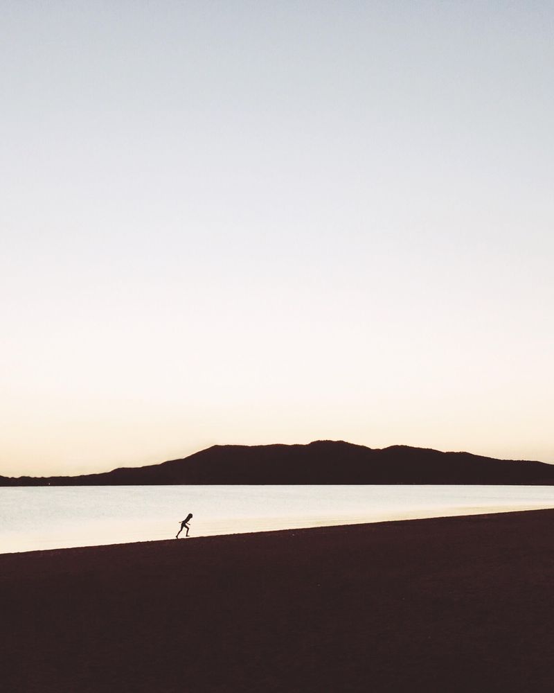 Silhouette of person standing on beach