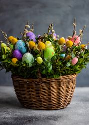 Side view of Easter card concept with fresh basket of greenery with colorful decorative eggs