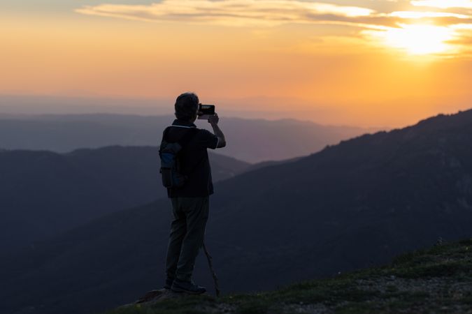 Man taking picture of landscape