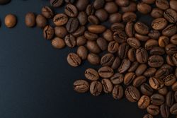 Scattered coffee beans on the side