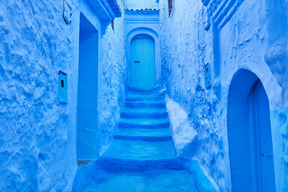 Narrow way to door between old buildings