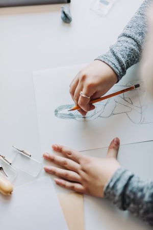 Woman doing linearity and first sketches in office
