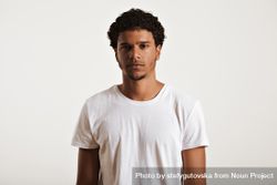 Portrait of Black man with neutral expression in studio shoot 4B2XM4