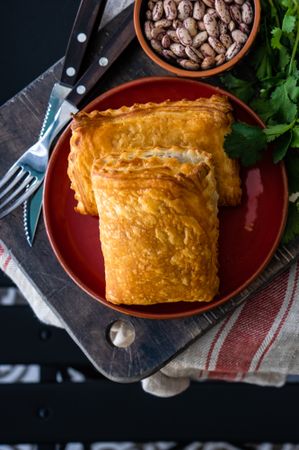 Top view of traditional Georgian lobiani pie with beans and herbs 