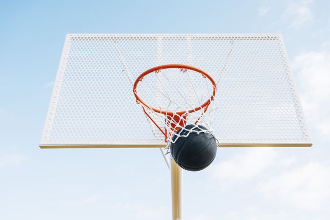 ball into basket in Outdoor basketball court and ball