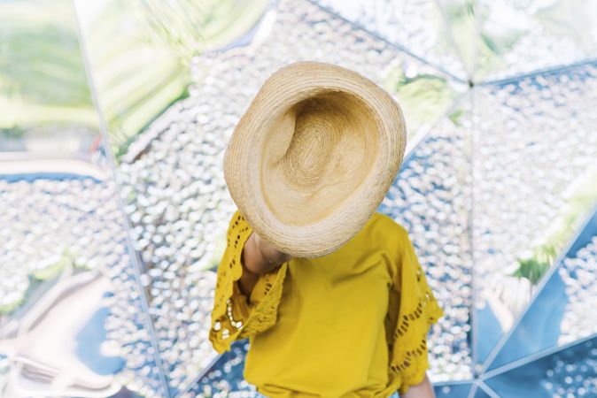 Woman throwing hat into air